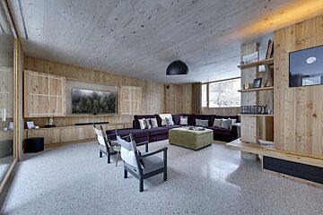 A living room with a sign that says enjoy