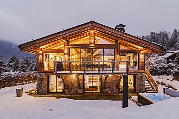 A large house with a hot tub in front of it