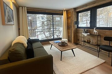 A living room with a couch and a coffee table