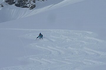 a skier in parallel tracks