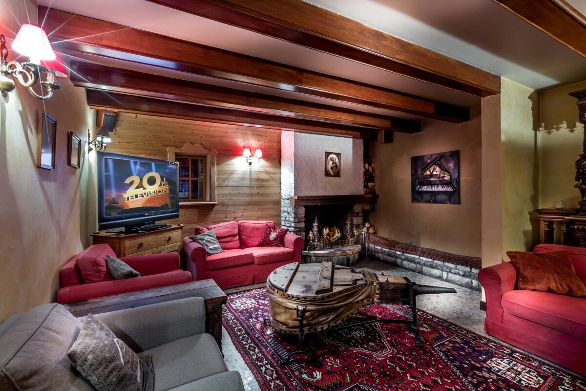 A living room with a flat screen tv that says 20th century fox
