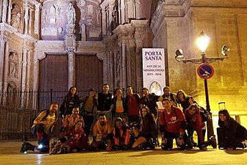 a group of roller skaters in front of a church in palma at night