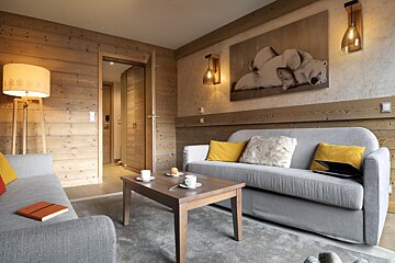 A living room with a couch and a coffee table