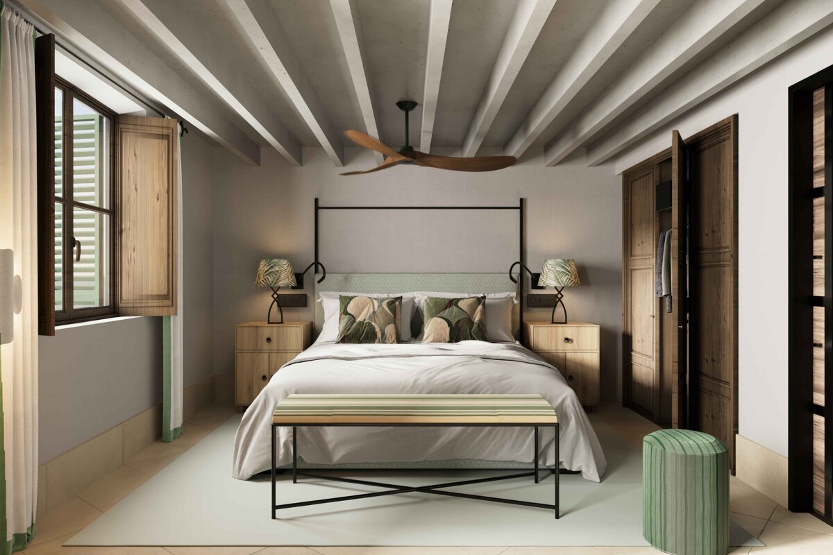 A bedroom with a bed and a ceiling fan