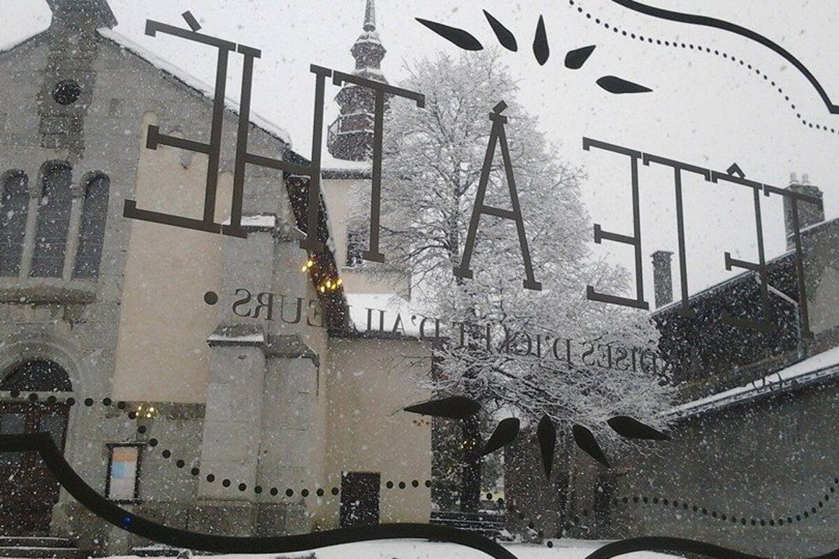 the view out of the window of the church opposite during snow