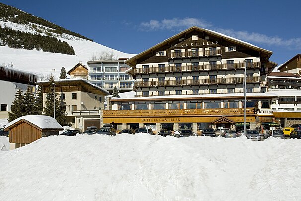 A hotel called le castillo is covered in snow
