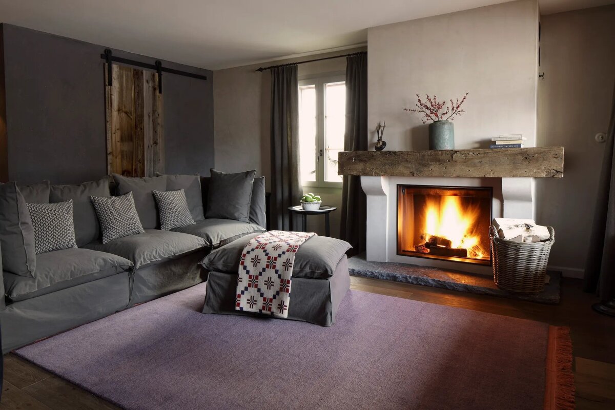 A living room with a fireplace and a couch