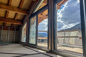 A building under construction with a view of the mountains