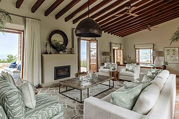 A living room filled with furniture and a fireplace