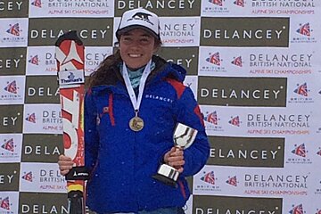 a skier holding a small trophy
