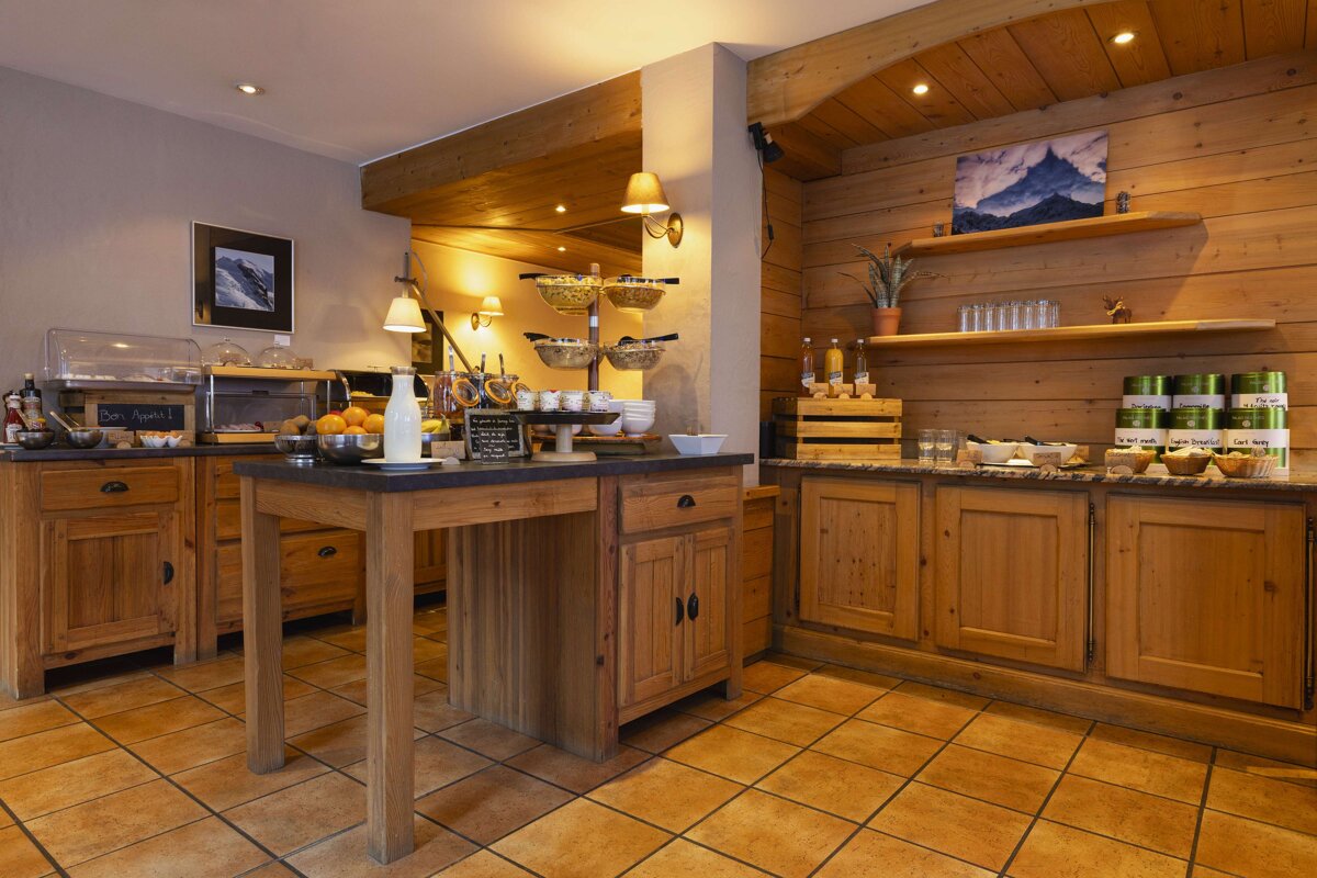 A kitchen with a sign on the counter that says ' buffet '