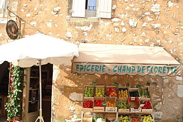 a picture of a pretty street side stall selling vegetables