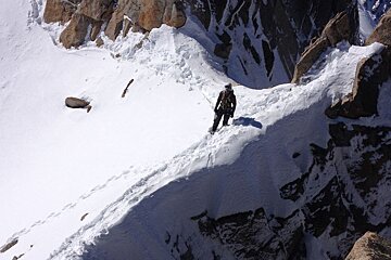 man on snow arete