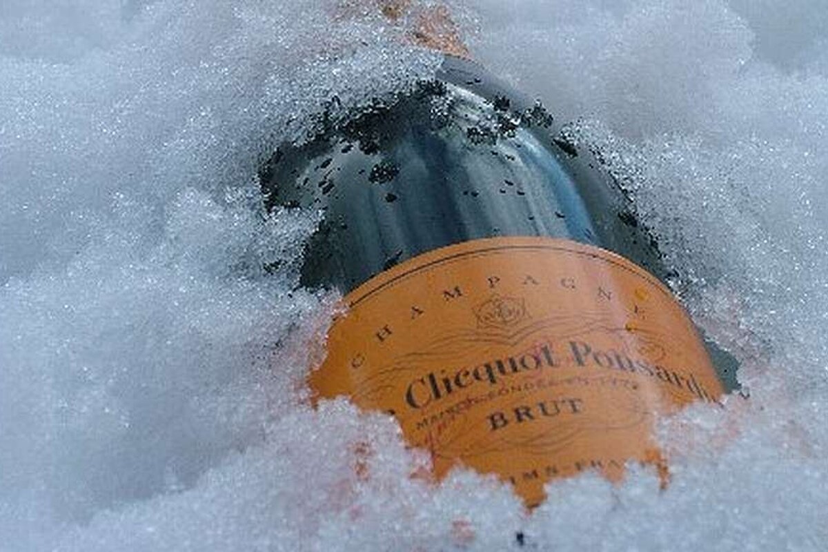 a bottle of champagne in snow