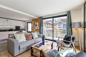 A living room with a couch and a coffee table