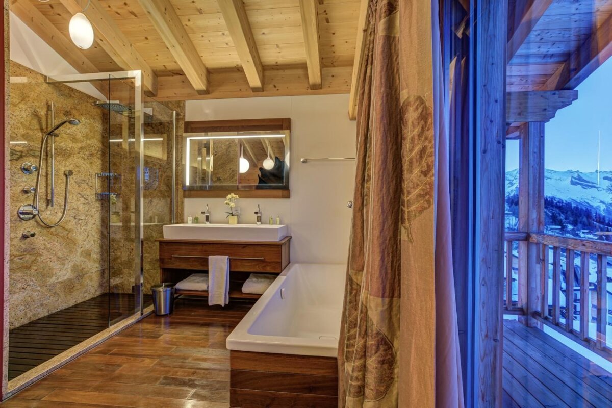 A bathroom with a bathtub and a walk in shower
