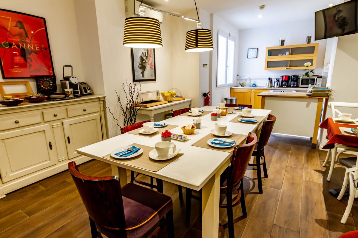 A room with a cannes poster on the wall