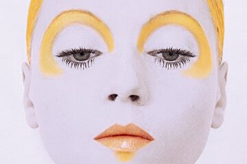 a fashion model with face paint