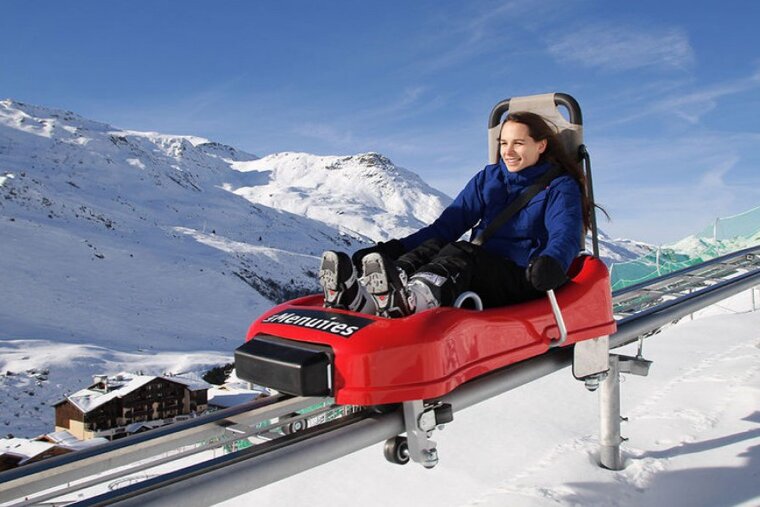 a girl on a small winter roller coaster
