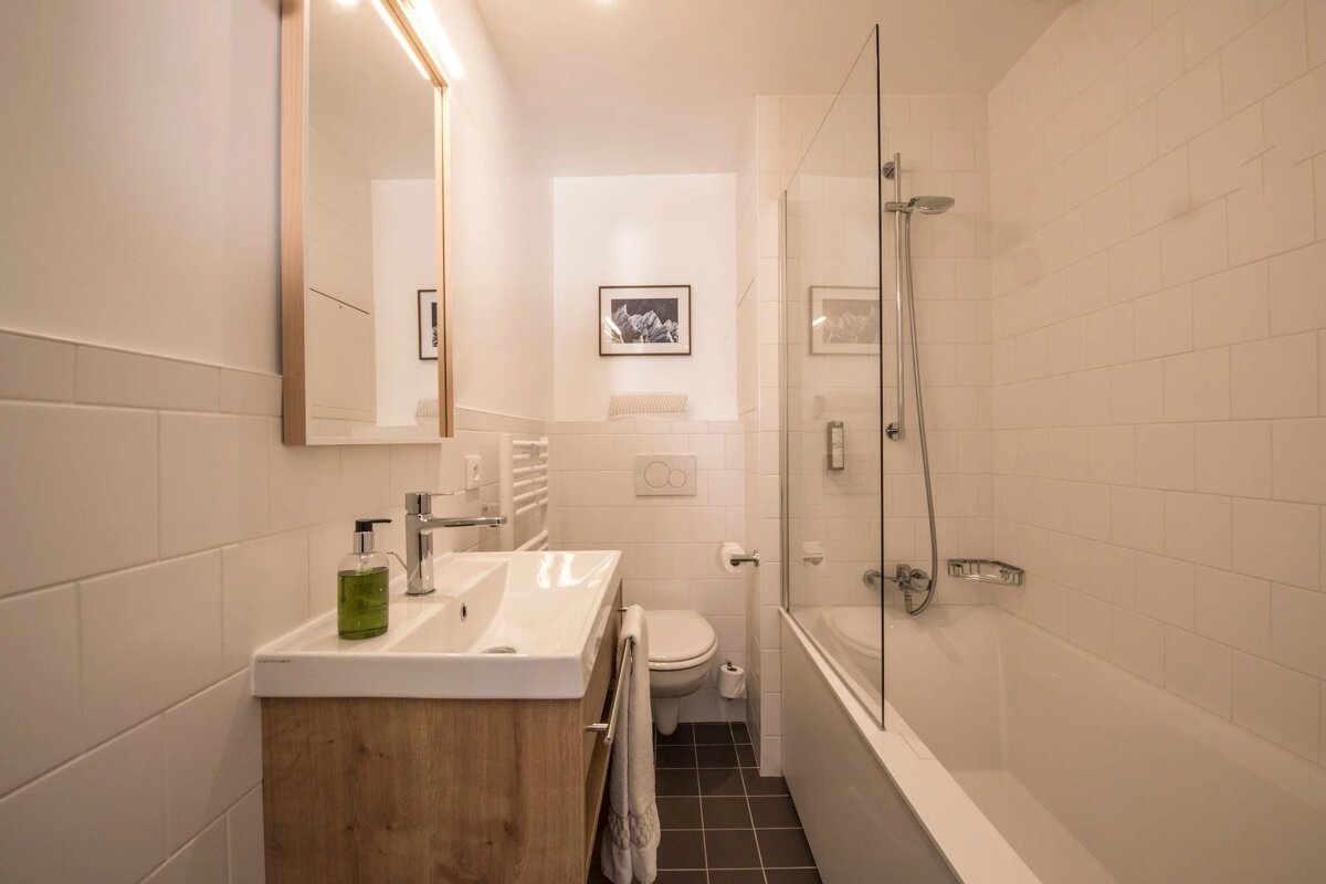 A bathroom with a sink toilet and bathtub