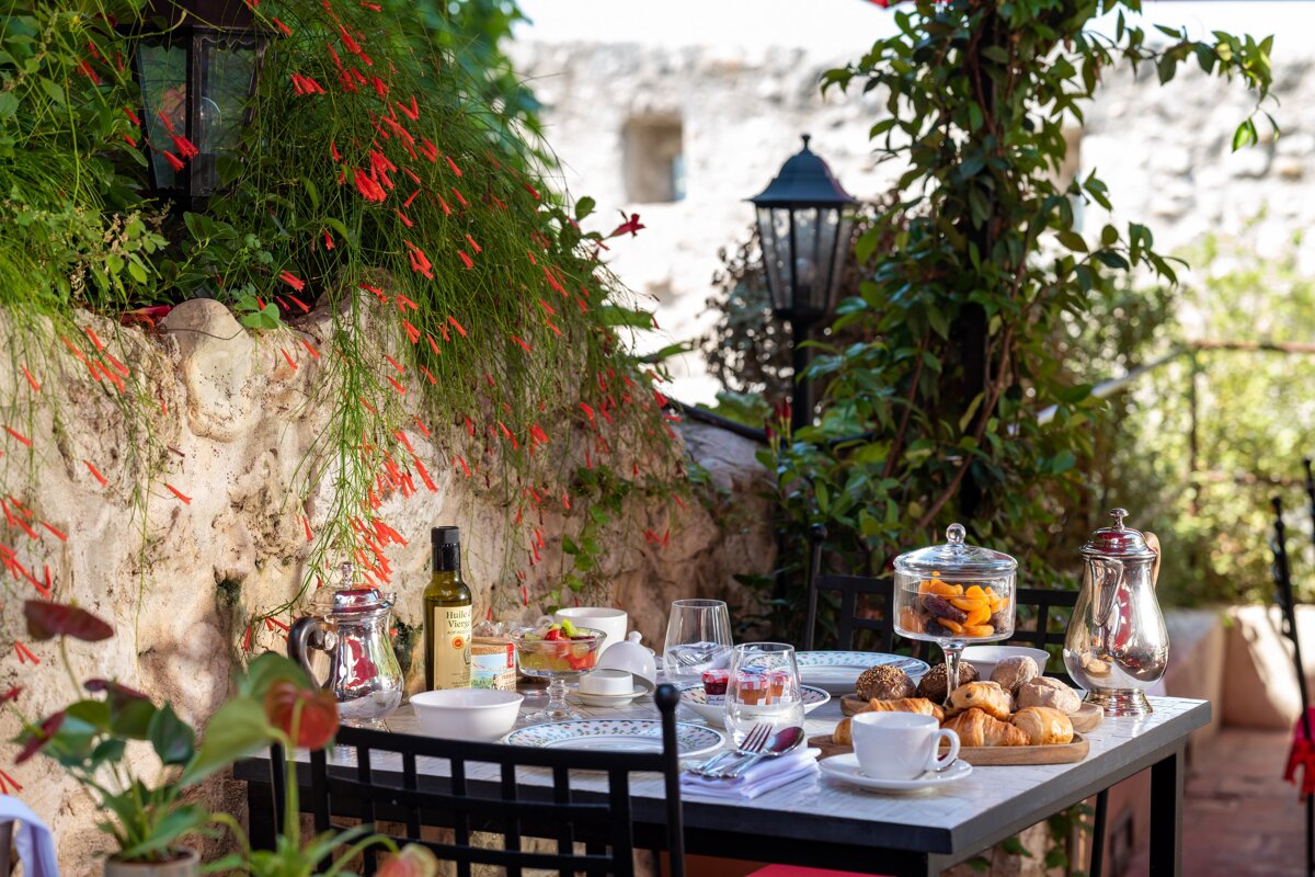 A table with a bottle of extra virgin olive oil on it