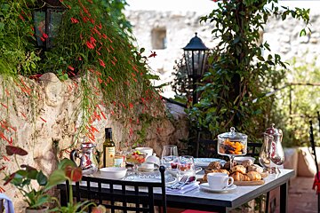 A table with a bottle of extra virgin olive oil on it