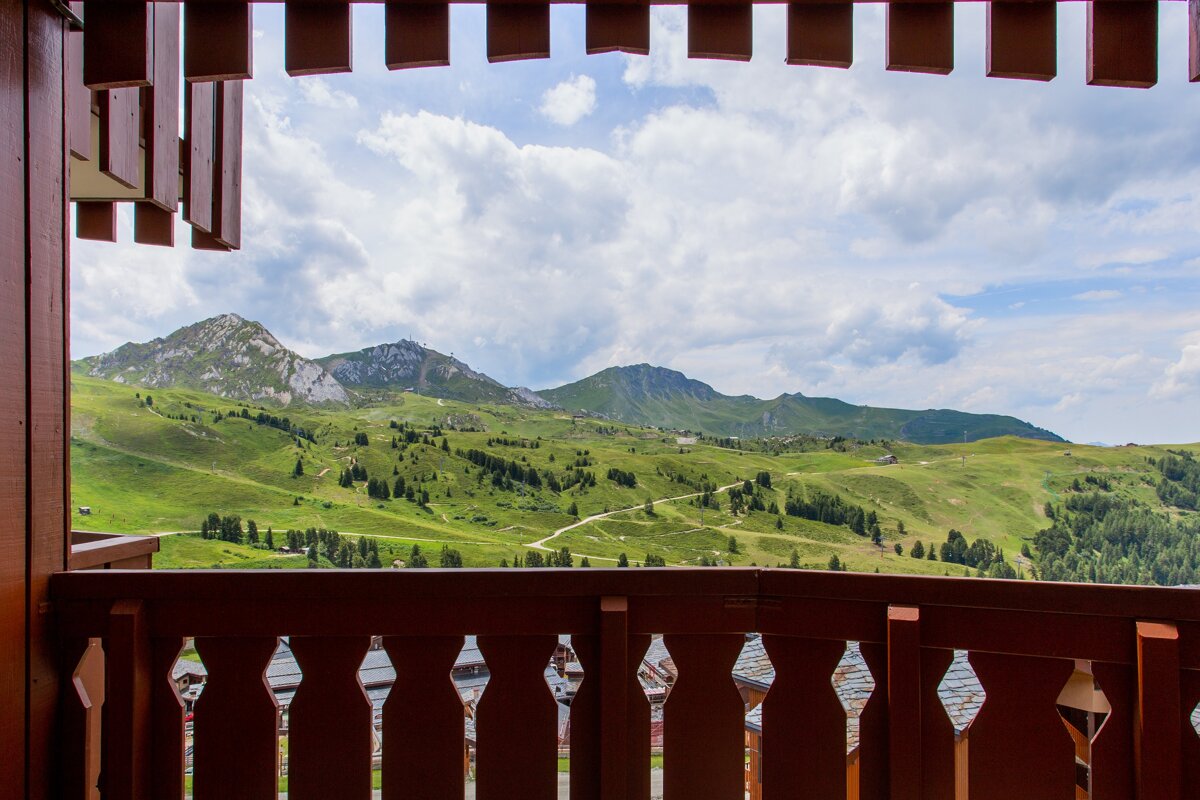 A view of a mountain range from a balcony