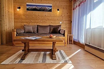 A living room with a couch and a coffee table