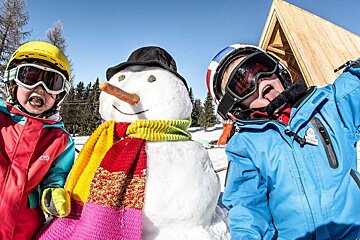 children with a snowman