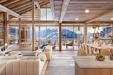 An artist 's impression of a living room and dining room with mountains in the background