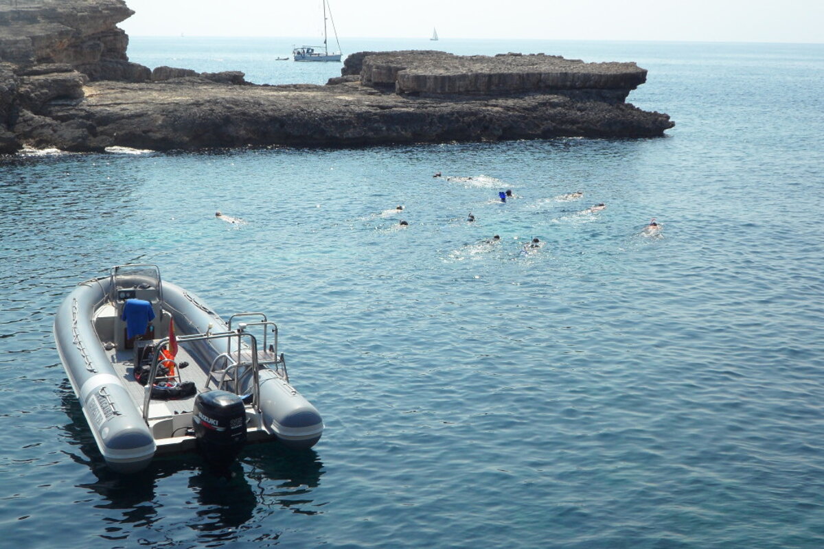 Photo of boat and snorkellers