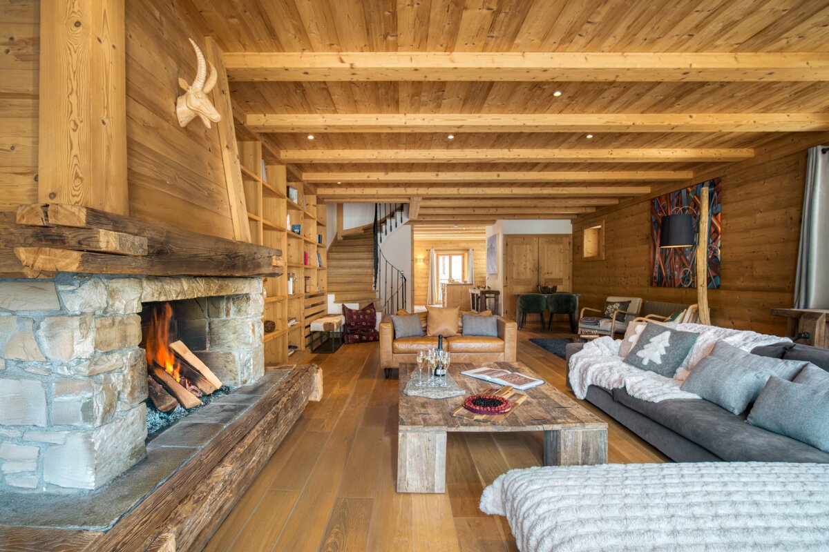A living room with a fireplace and a couch