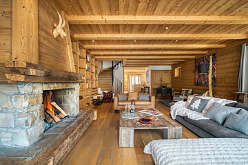 A living room with a fireplace and a couch