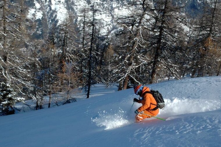 Skiing in between the trees at Bruson
