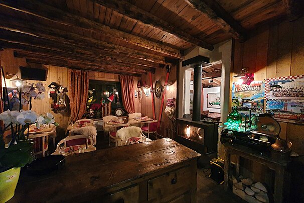 A room with a fireplace and a clock on the wall