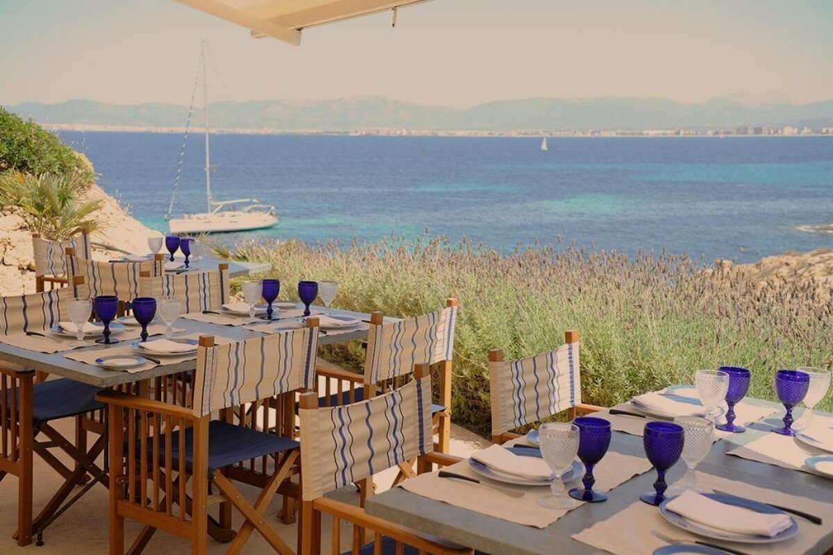 A table with a view of the ocean and mountains