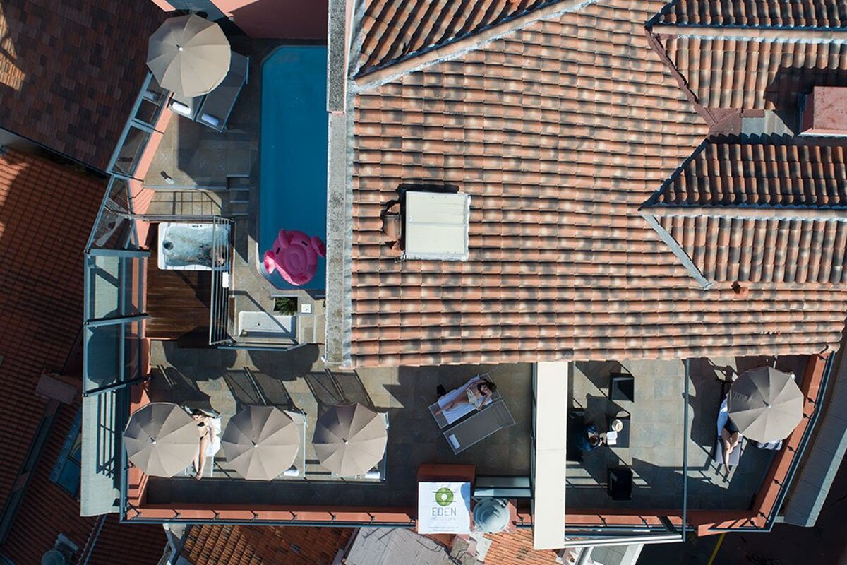 An aerial view of a building with a sign that says oliva