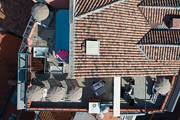An aerial view of a building with a sign that says oliva