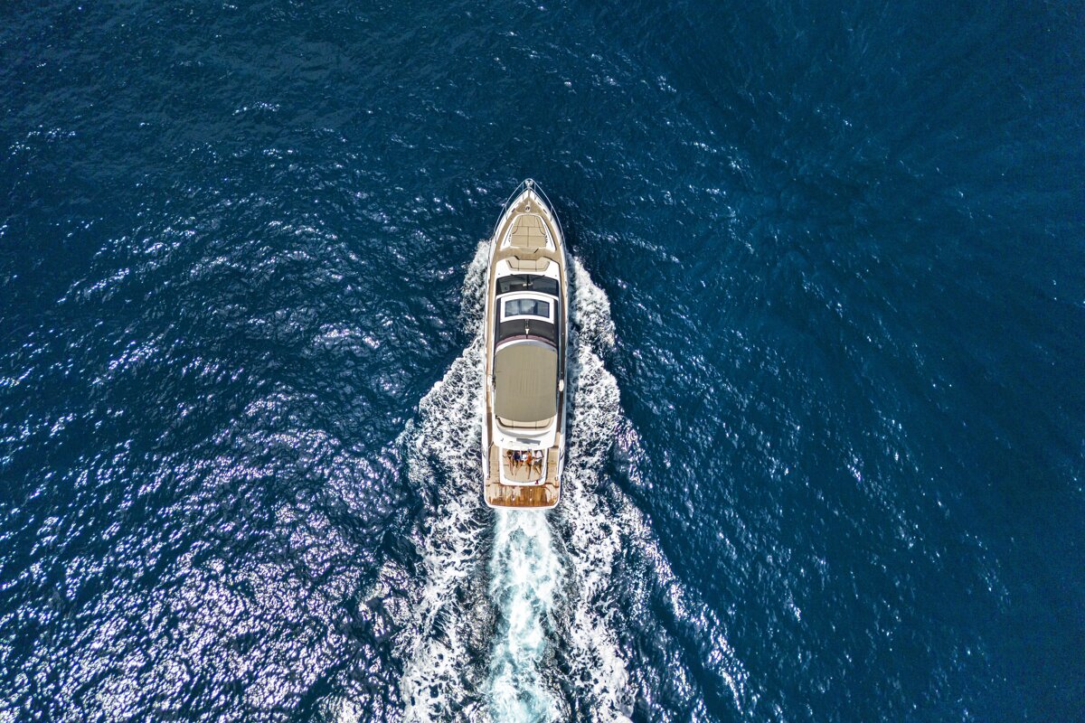An aerial view of a yacht in the ocean