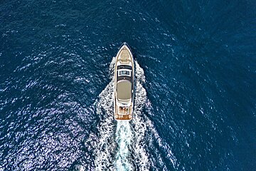 An aerial view of a yacht in the ocean