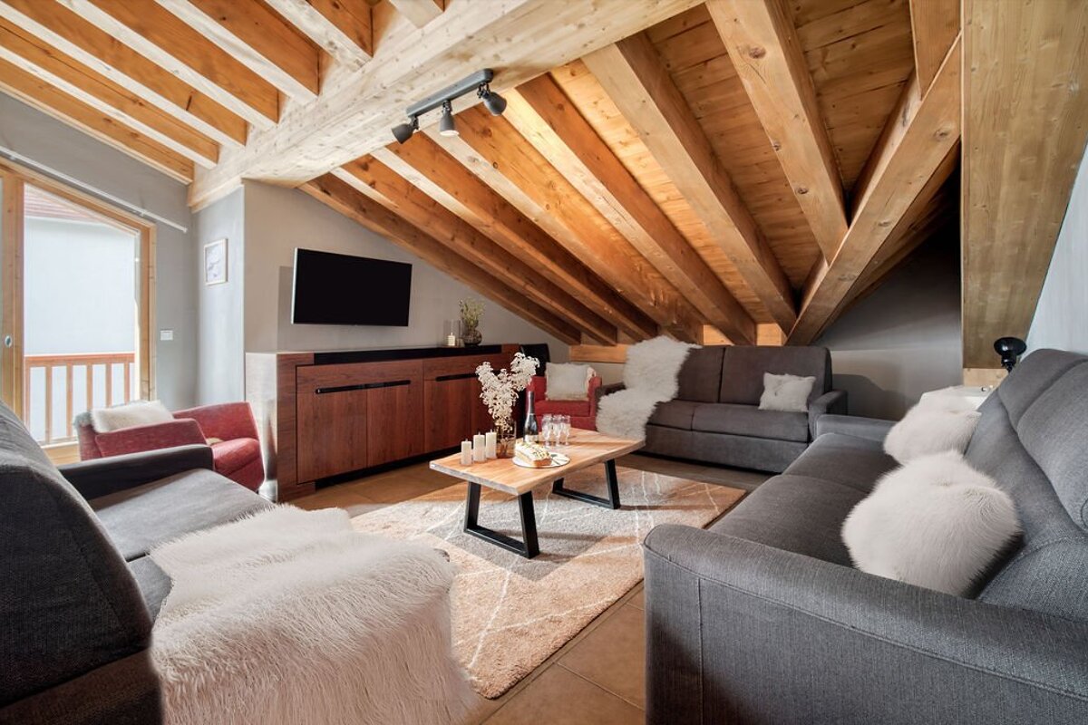 A living room filled with furniture and a flat screen tv