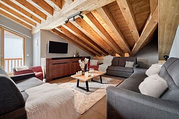 A living room filled with furniture and a flat screen tv