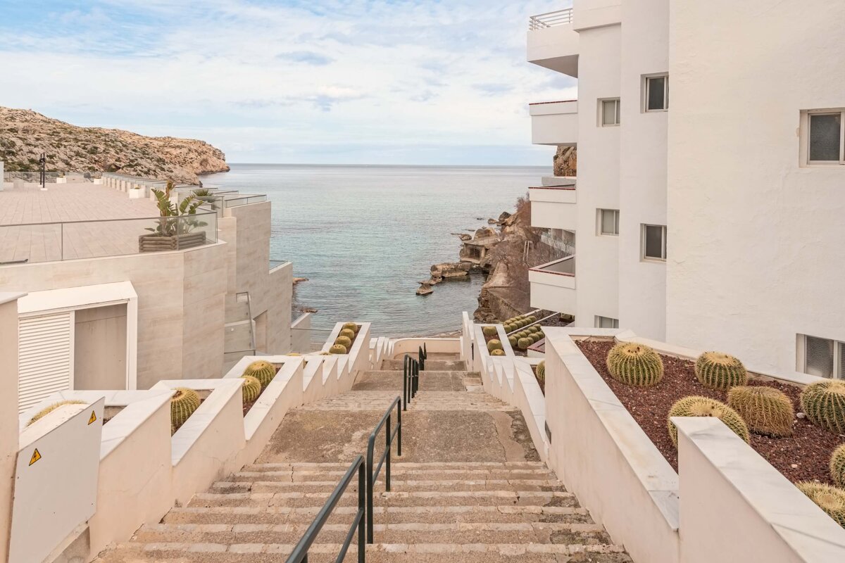 A set of stairs leading up to the ocean