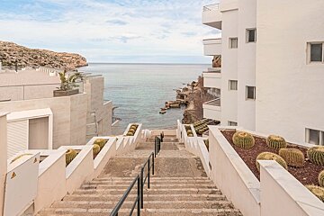 A set of stairs leading up to the ocean