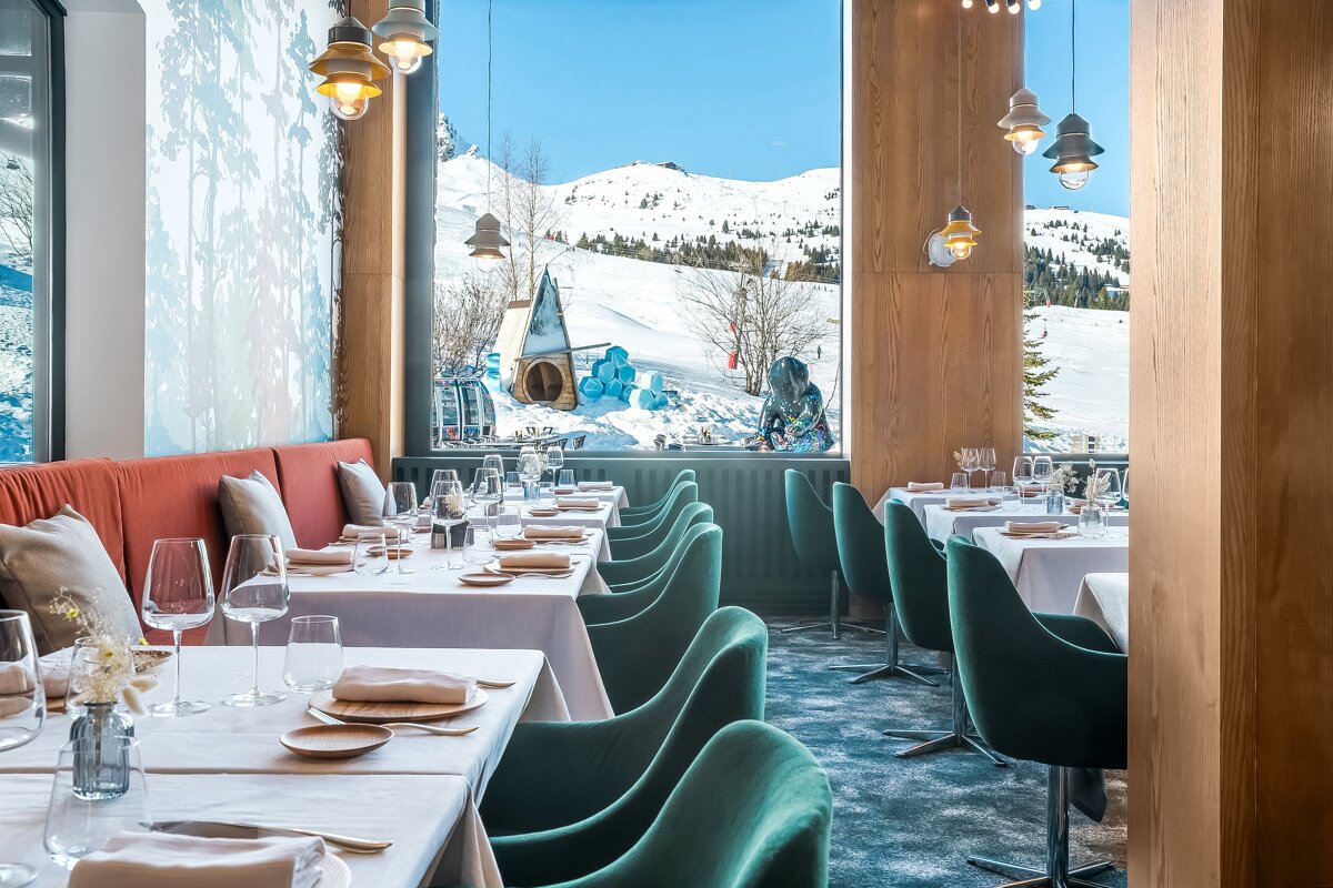 A restaurant with a view of a snowy mountain