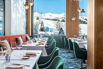 A restaurant with a view of a snowy mountain