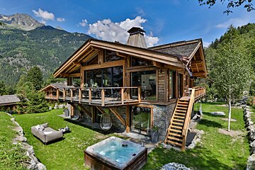 A large house with a hot tub in front of it