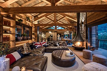 A living room filled with furniture and a fireplace