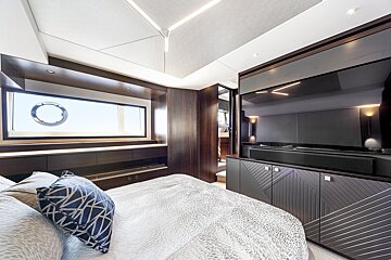 A bedroom with a large tv on the wall