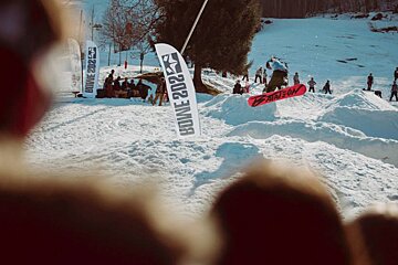 a snowboarder jumping through the air